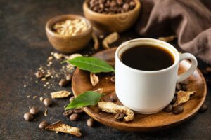 Mushroom coffee in a cup and coffee beans, trendy drink.